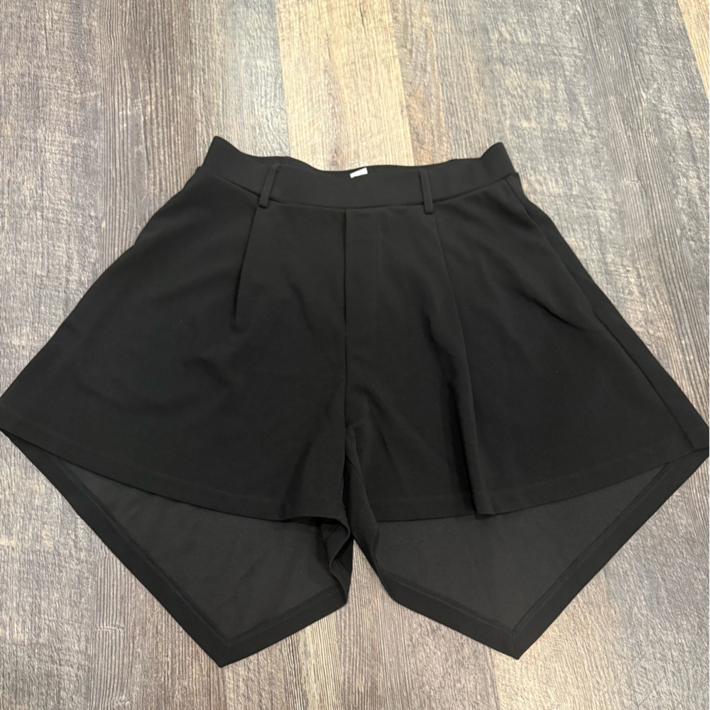 NWOT Halara black shorts with long asymmetrical hem in the back